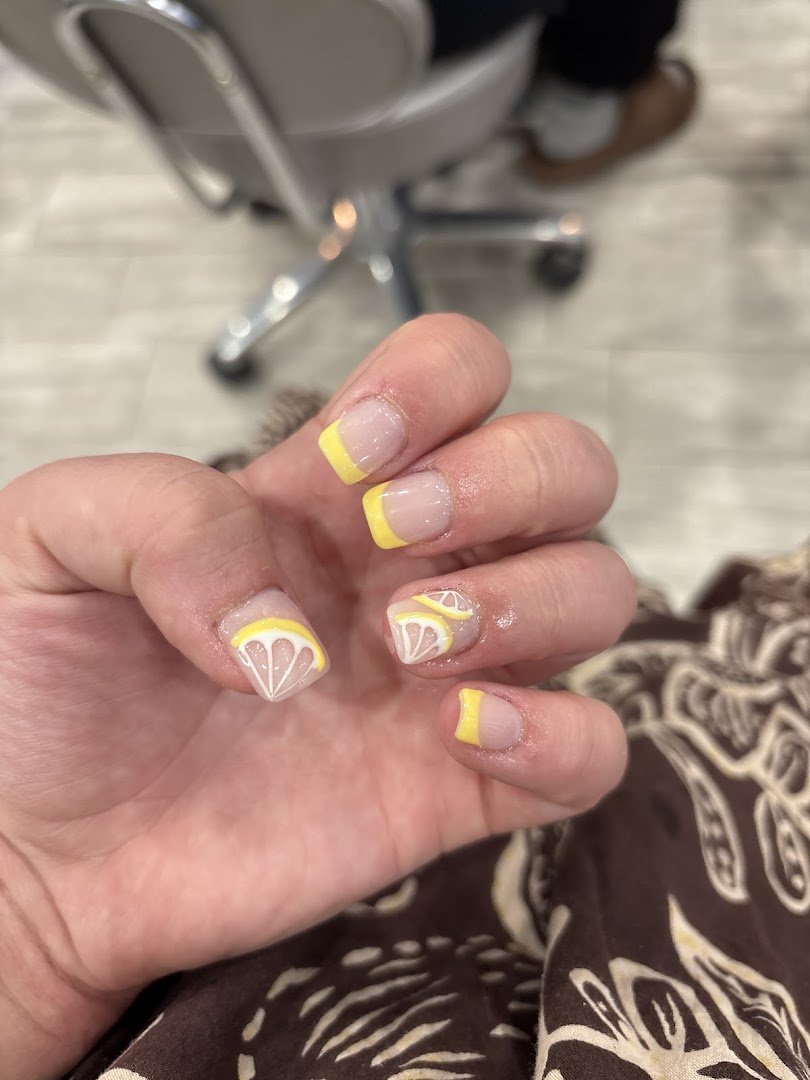 Acrylic and gel nail work on display.