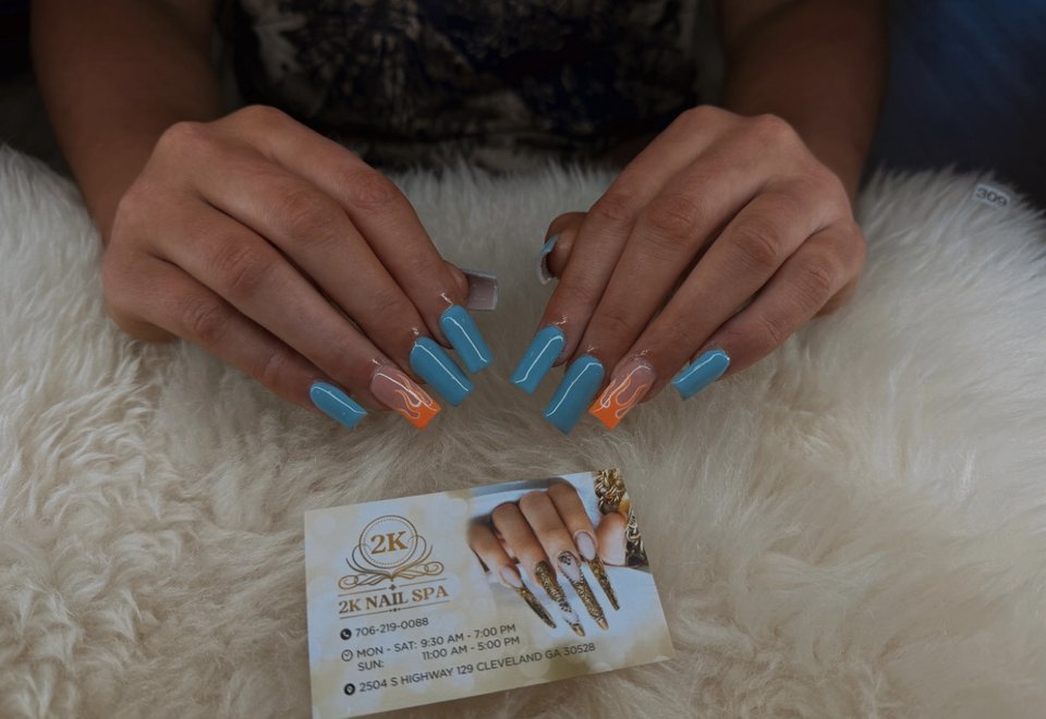 Manicured nails displayed in a salon setting.